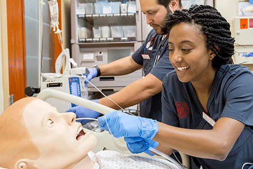 Nursing student working in simulation lab